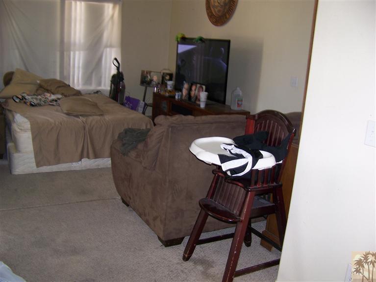 68220 Santelmo Road Cathedral City, CA 92234 - Photo 14 of 21 a living room with furniture a flat screen tv and a window