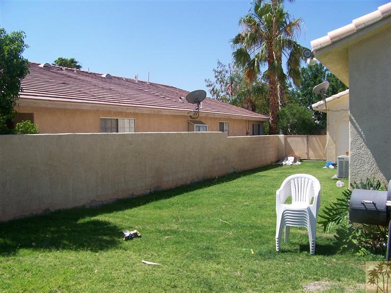 68220 Santelmo Road Cathedral City, CA 92234 - Photo 3 of 21 a view of backyard with a garden and entertaining space
