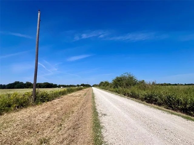 a view of a yard with an ocean