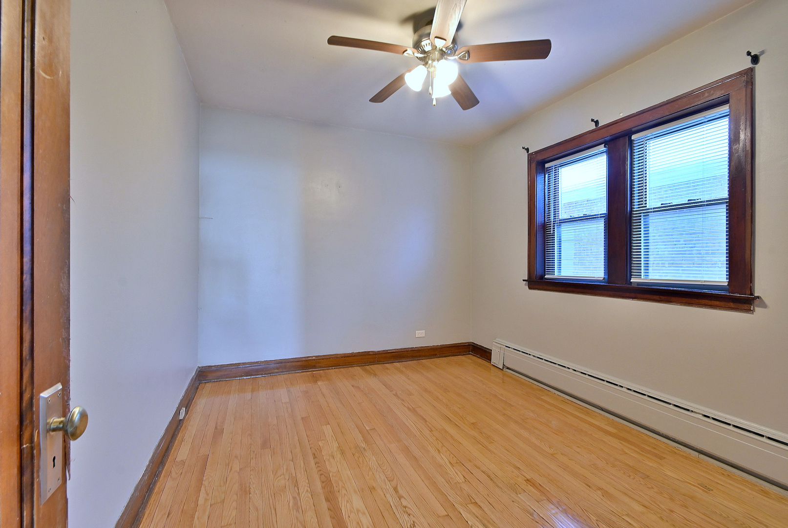 1835 Home Avenue Berwyn, IL 60402 - Photo 15 of 30 a view of empty room with wooden floor and fan
