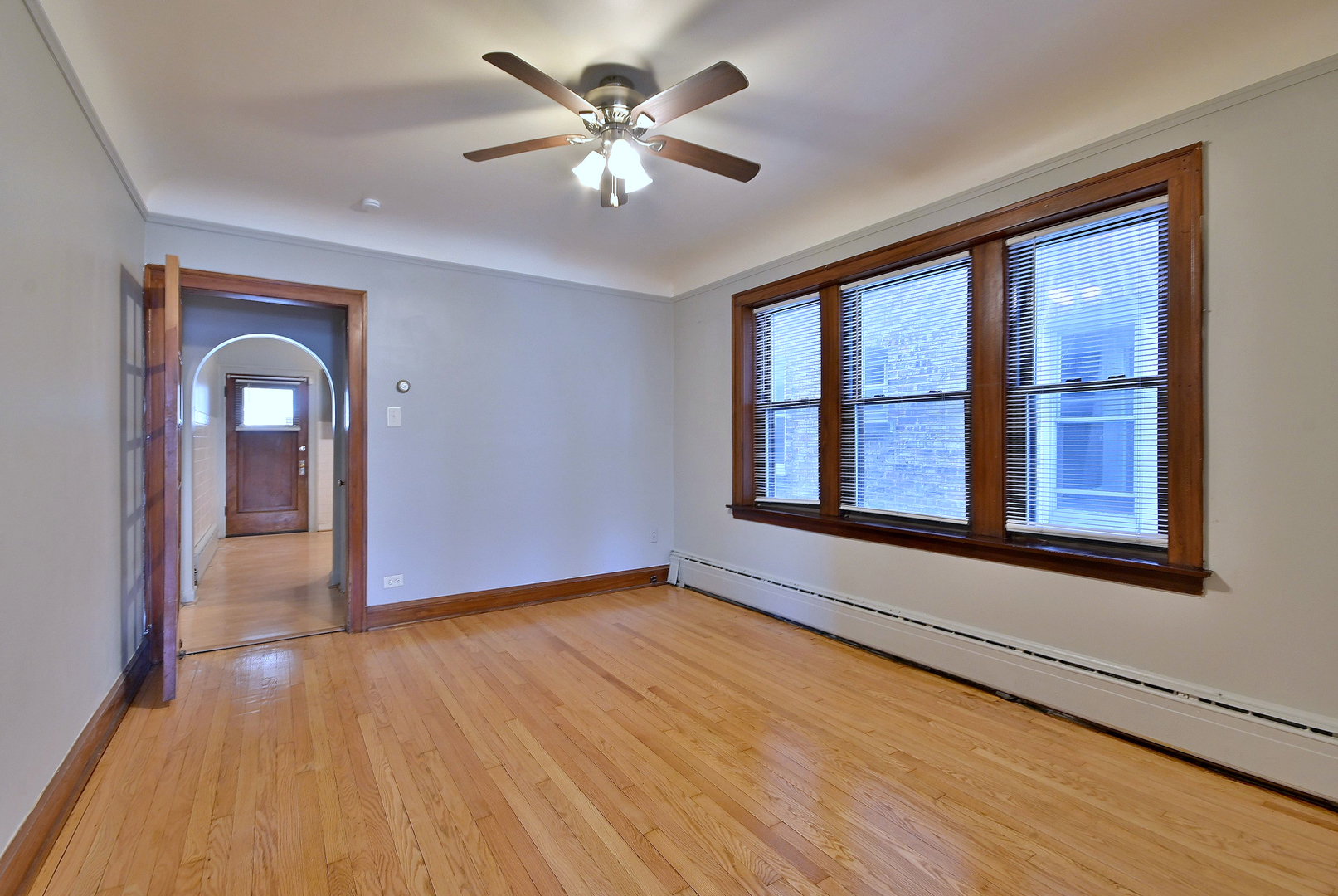 1835 Home Avenue Berwyn, IL 60402 - Photo 18 of 30 a view of an empty room with window and wooden floor