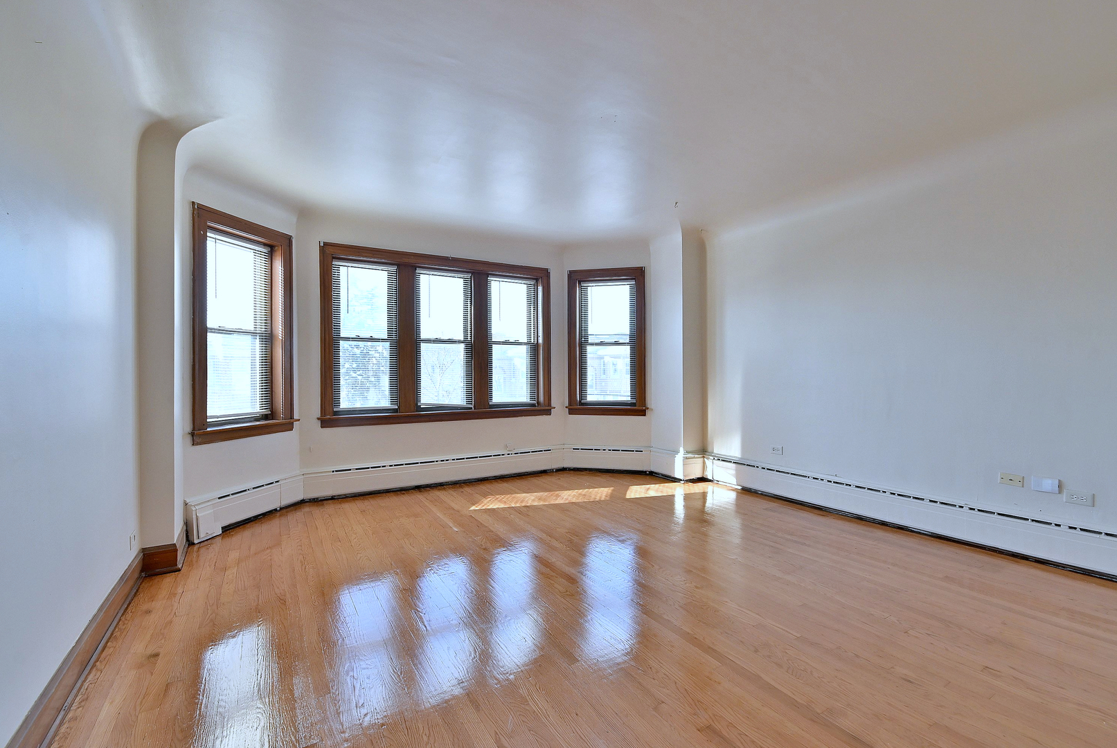 1835 Home Avenue Berwyn, IL 60402 - Photo 3 of 30 wooden floor in an empty room with a window