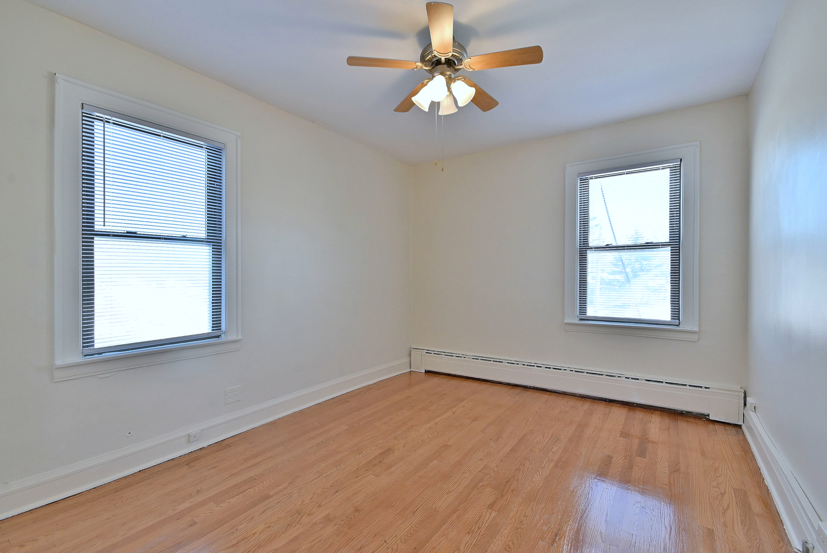 1835 Home Avenue Berwyn, IL 60402 - Photo 5 of 30 an empty room with a window and a fan