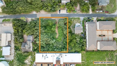 an aerial view of residential building and lake