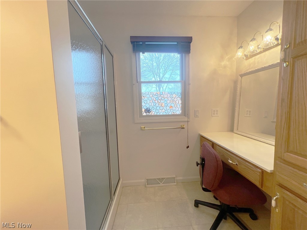 5203 Ridgeland Street Lorain, OH 44055 - Photo 16 of 39 Bathroom with vanity, tile flooring, and a shower with door