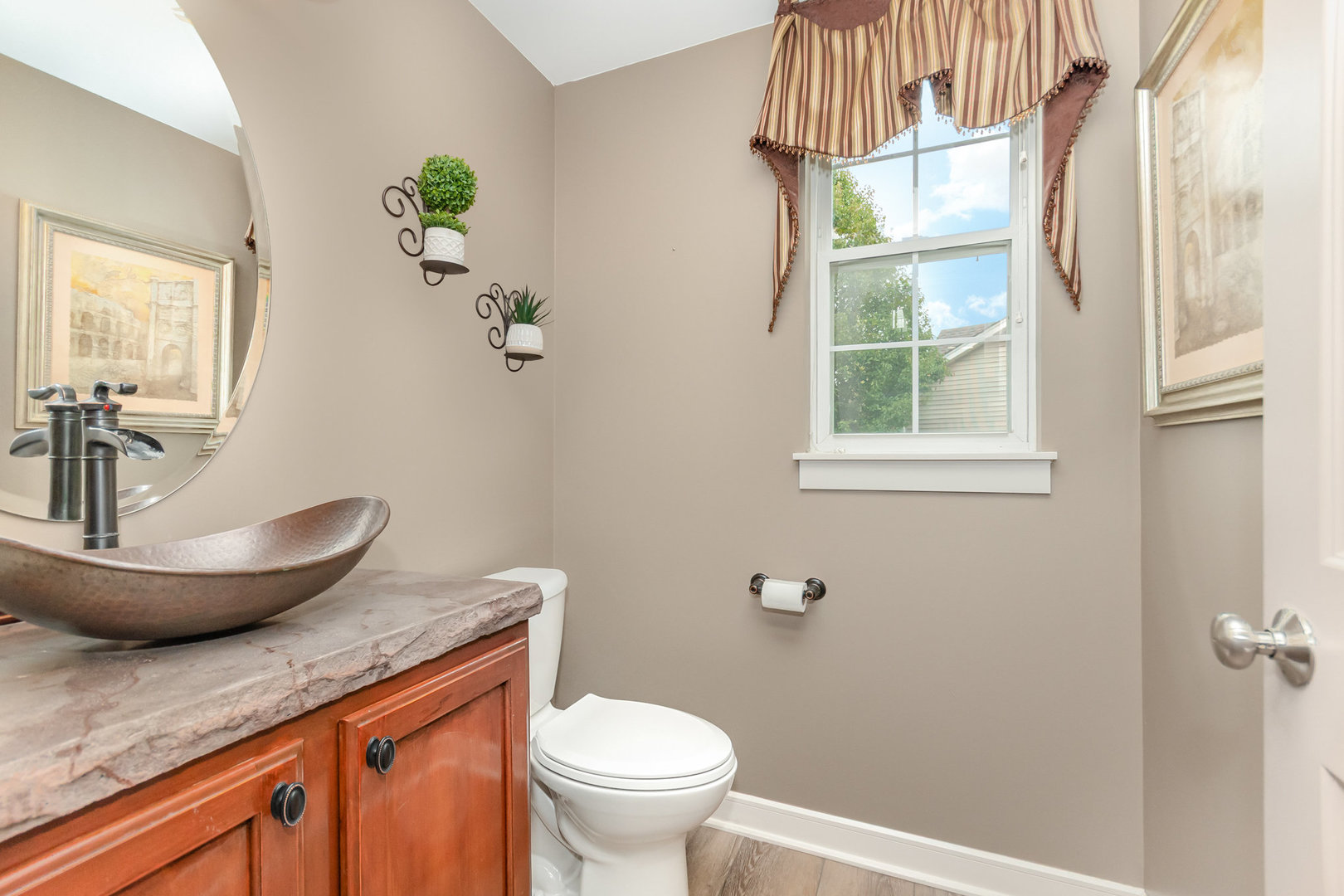 2576 Lyman Loop Yorkville, IL 60560 - Photo 25 of 52 a bathroom with a granite countertop toilet a sink and a window