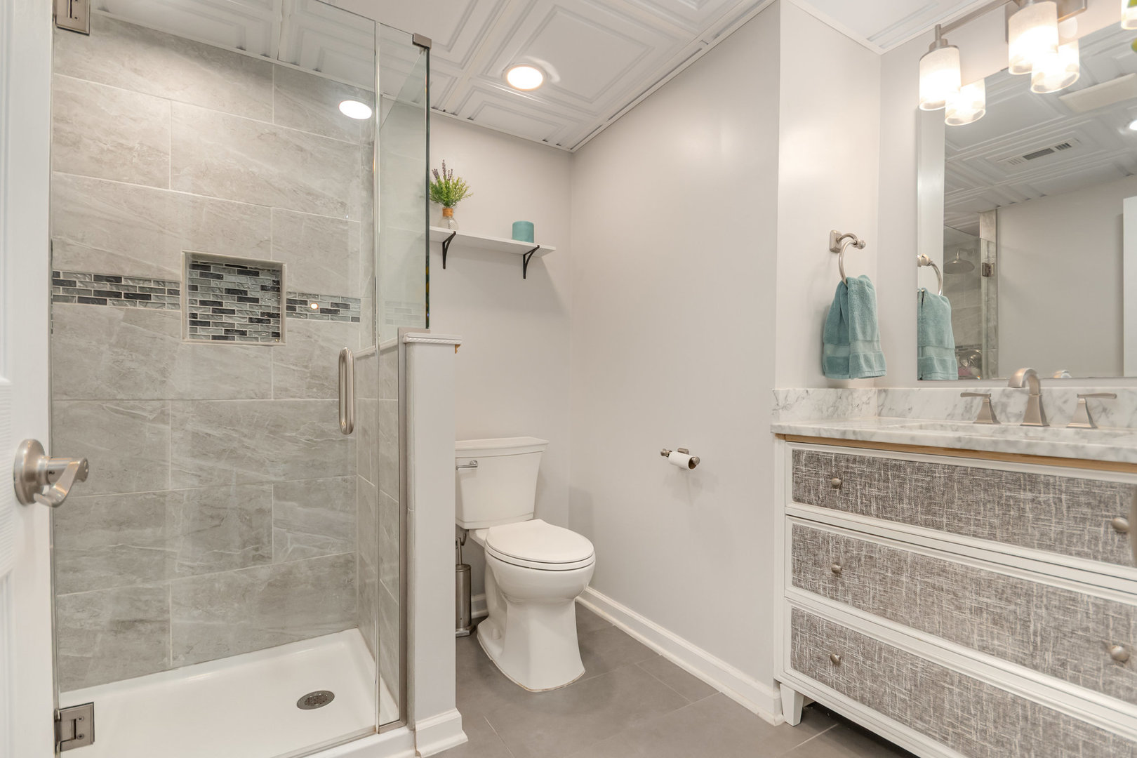 2576 Lyman Loop Yorkville, IL 60560 - Photo 39 of 52 a bathroom with a shower a sink a toilet and a mirror