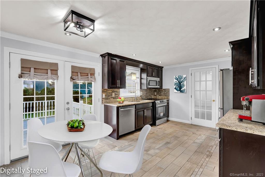 15 Chauncey Road Wethersfield, CT 06109 - Photo 1 of 1 a kitchen with a sink appliances and cabinets