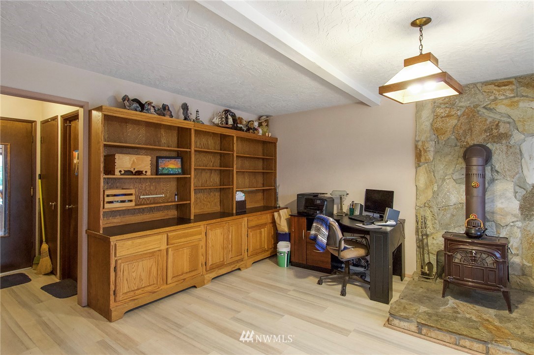 1493 Atterberry Road Sequim, WA 98382 - Photo 16 of 40 a view of a workspace with furniture and wooden floor