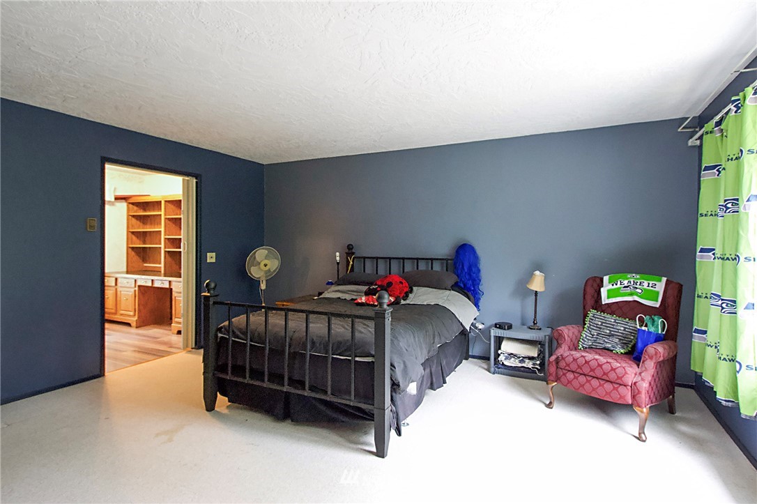 1493 Atterberry Road Sequim, WA 98382 - Photo 20 of 40 a bedroom with furniture and a window