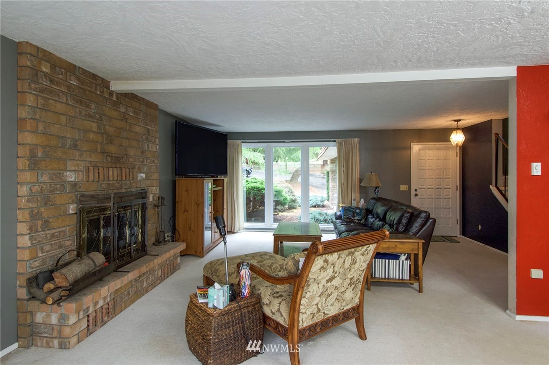 1493 Atterberry Road Sequim, WA 98382 - Photo 3 of 40 a living room with furniture and a fireplace