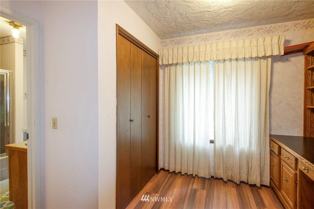 1493 Atterberry Road Sequim, WA 98382 - Photo 21 of 40 a view of a room with wooden floor and staircase
