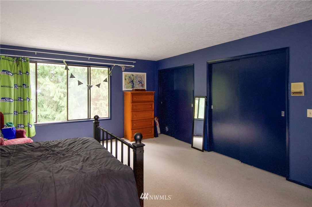 1493 Atterberry Road Sequim, WA 98382 - Photo 24 of 40 a bed room with a bed and a window