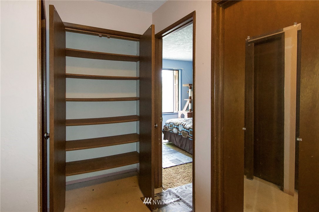 1493 Atterberry Road Sequim, WA 98382 - Photo 27 of 40 a view of a room that has a bed in it