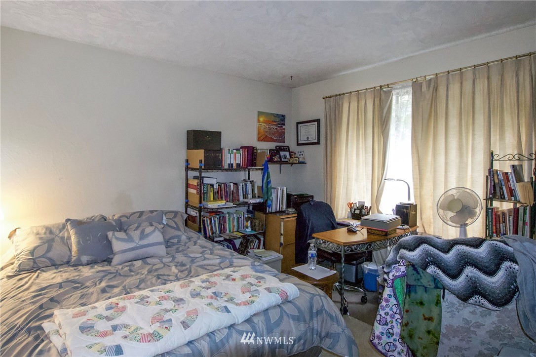1493 Atterberry Road Sequim, WA 98382 - Photo 29 of 40 a bed room with a bed and a couch