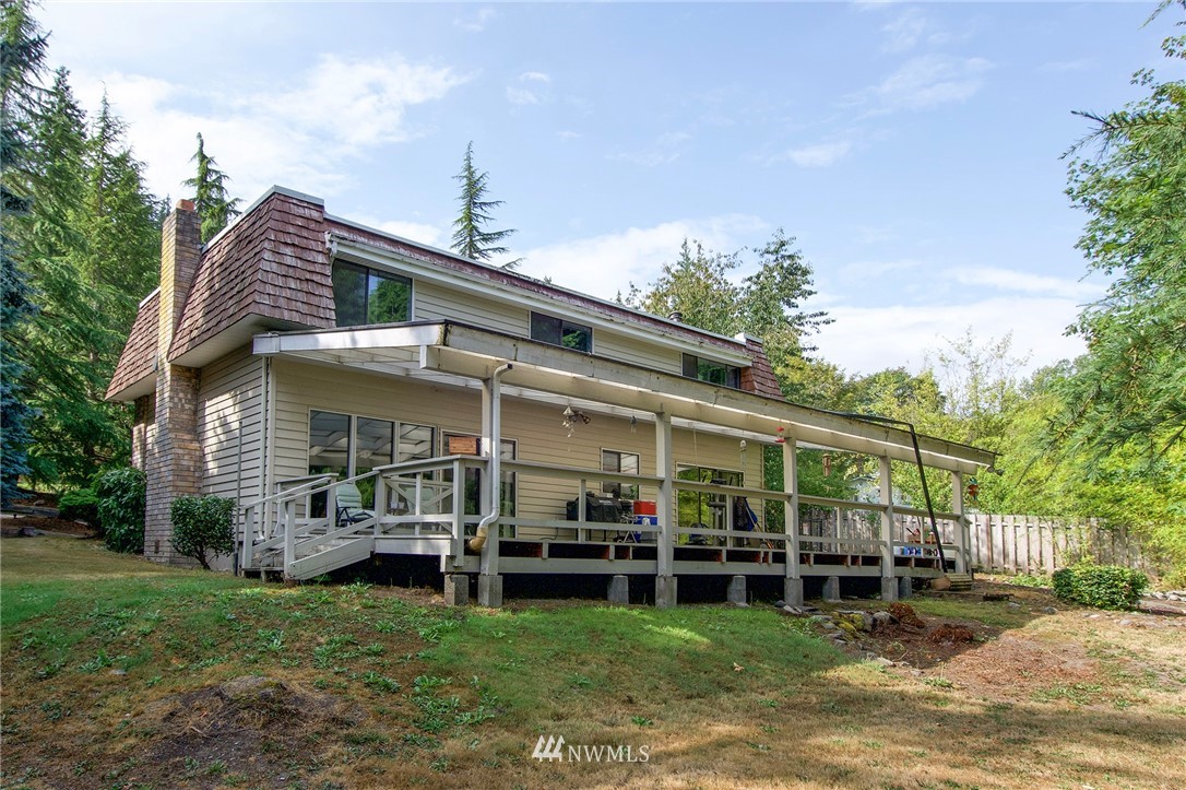 1493 Atterberry Road Sequim, WA 98382 - Photo 35 of 40 a view of a house with backyard porch and sitting area