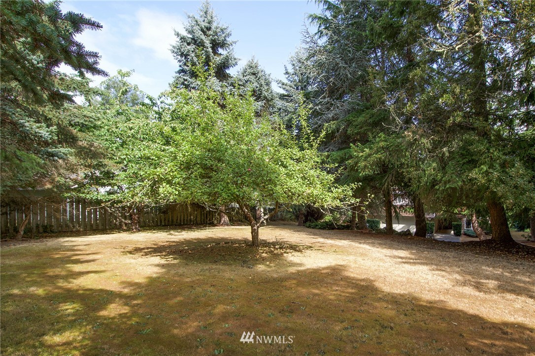 1493 Atterberry Road Sequim, WA 98382 - Photo 38 of 40 a view of outdoor space with deck and trees