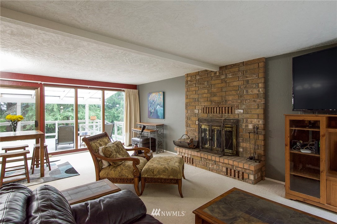 1493 Atterberry Road Sequim, WA 98382 - Photo 5 of 40 a living room with furniture and a fireplace