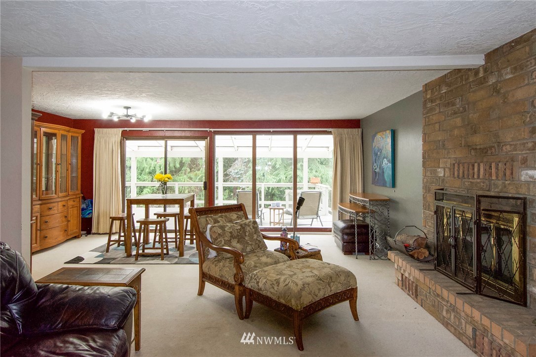 1493 Atterberry Road Sequim, WA 98382 - Photo 6 of 40 a living room with furniture and a fireplace