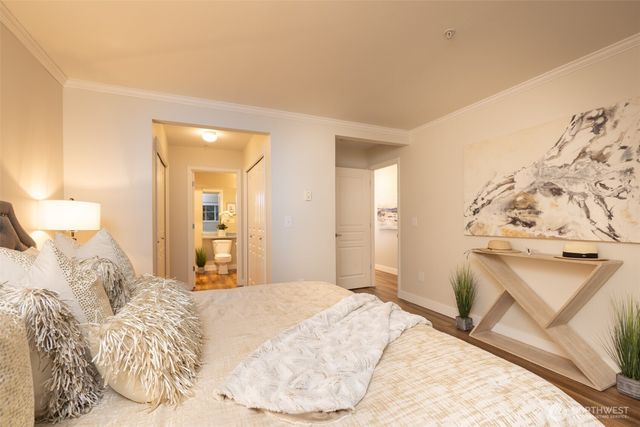 a bedroom with a bed and a couch