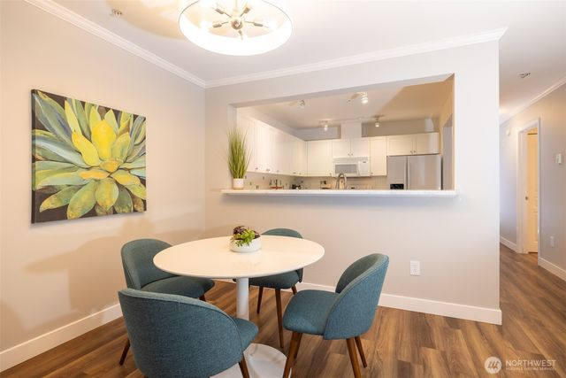 a view of a dining room with furniture and wooden floor