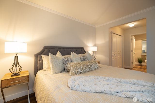 a bedroom with a bed and lamp