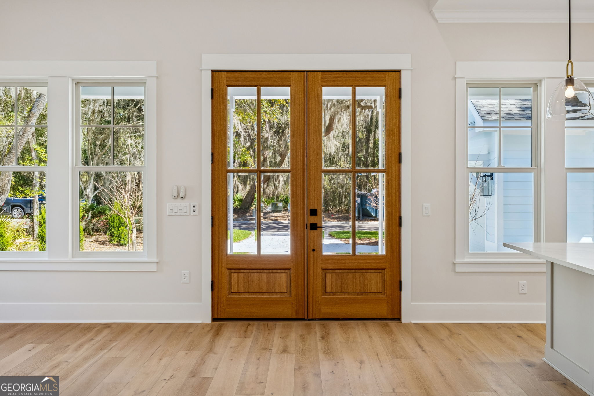 308 Anchor Way St. Marys, GA 31558 - Photo 14 of 55 an empty room with wooden floor and windows