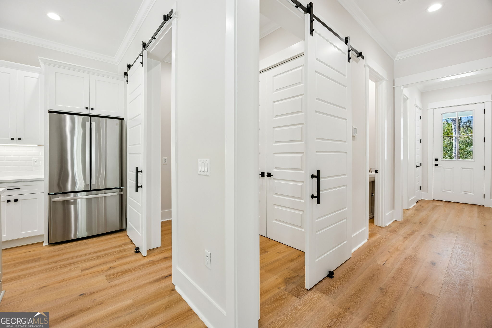 308 Anchor Way St. Marys, GA 31558 - Photo 16 of 55 a view of a hallway with wooden floor and staircase
