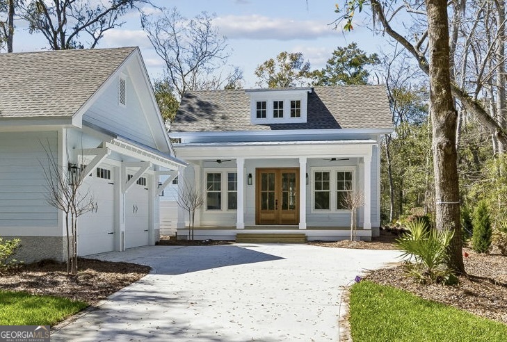 308 Anchor Way St. Marys, GA 31558 - Photo 2 of 55 a front view of a house with a garden