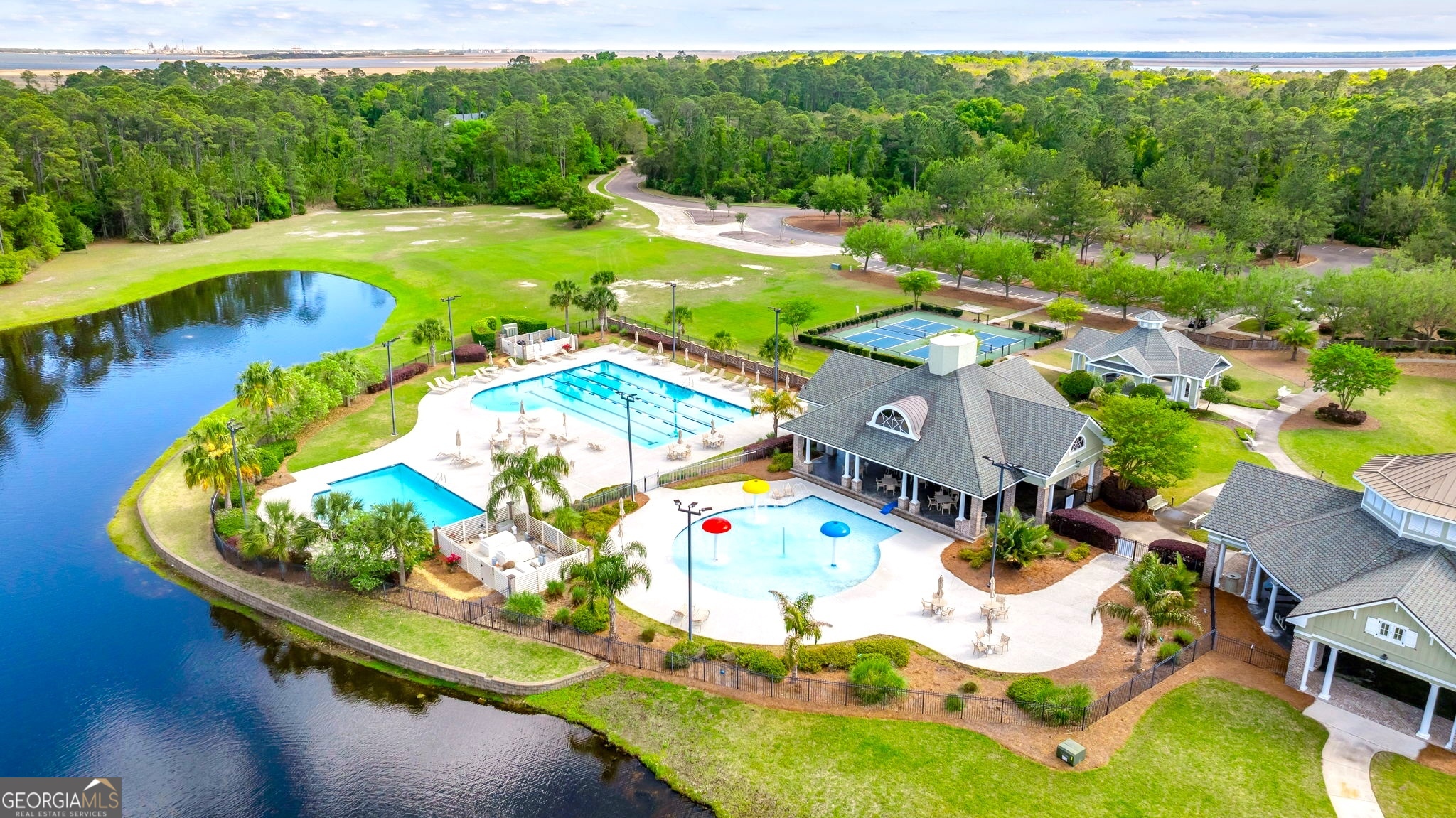 308 Anchor Way St. Marys, GA 31558 - Photo 23 of 55 a view of a swimming pool with a garden