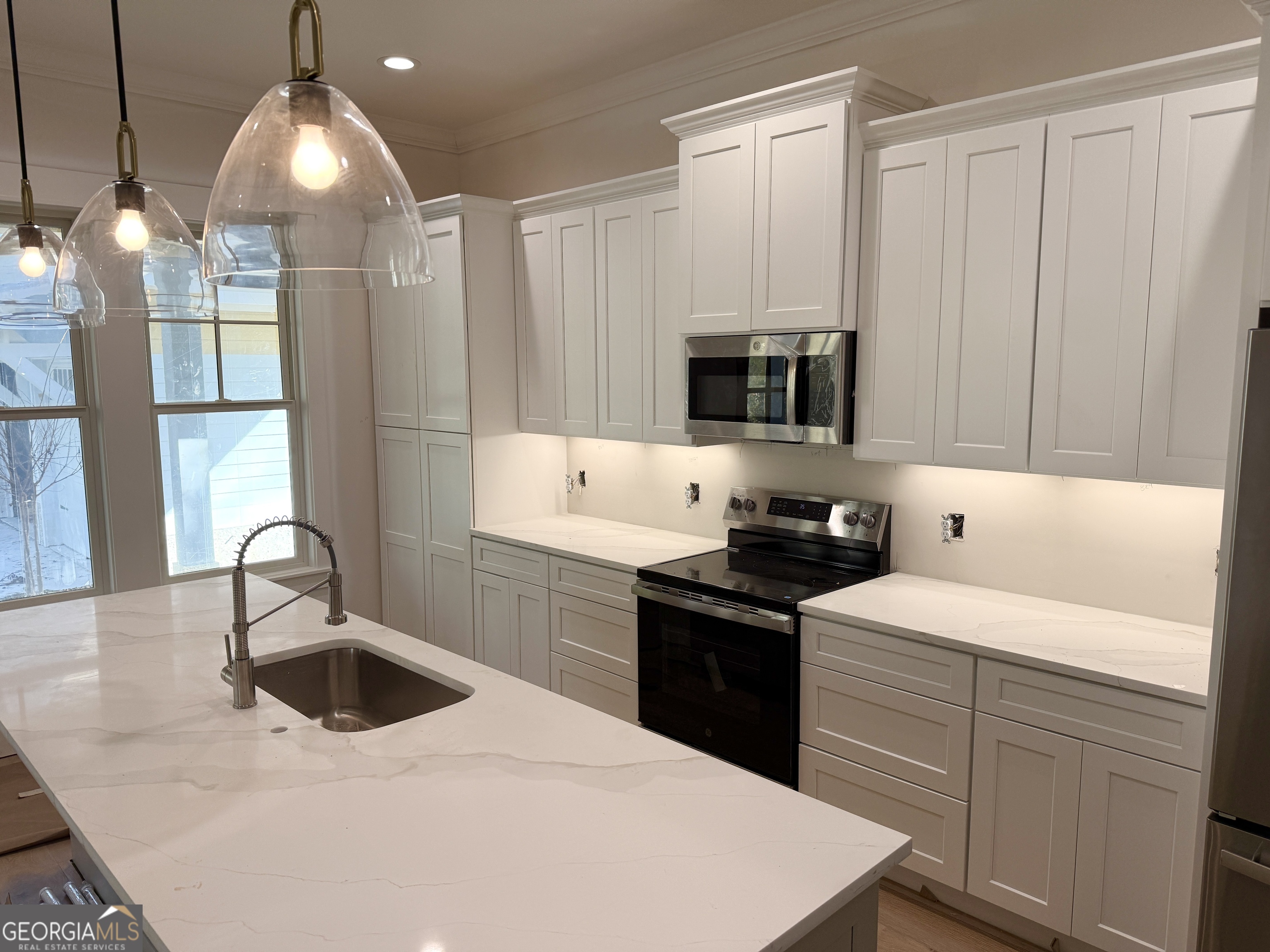 308 Anchor Way St. Marys, GA 31558 - Photo 3 of 21 a kitchen with a sink a stove and cabinets