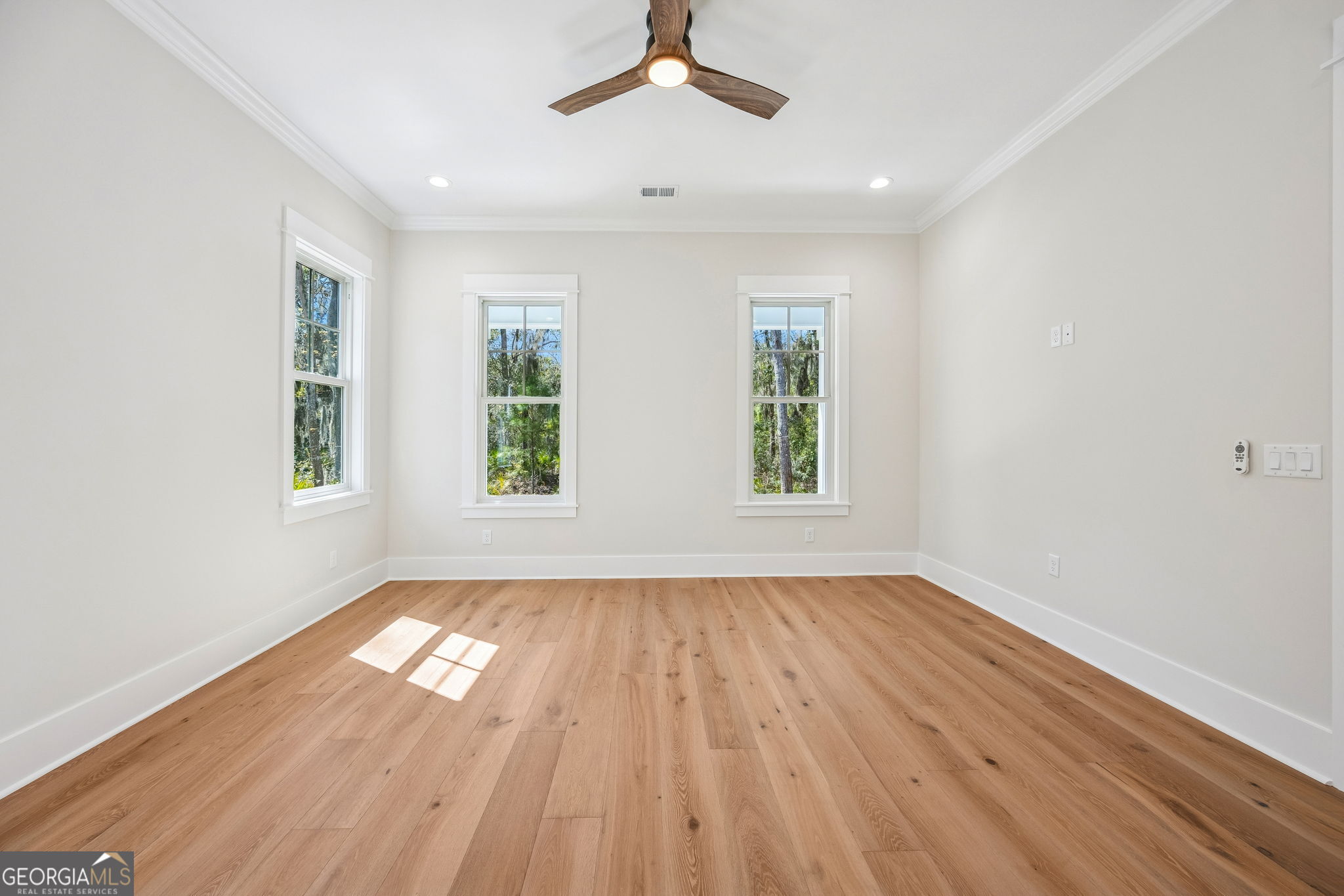 308 Anchor Way St. Marys, GA 31558 - Photo 34 of 55 wooden floor in an empty room with a window