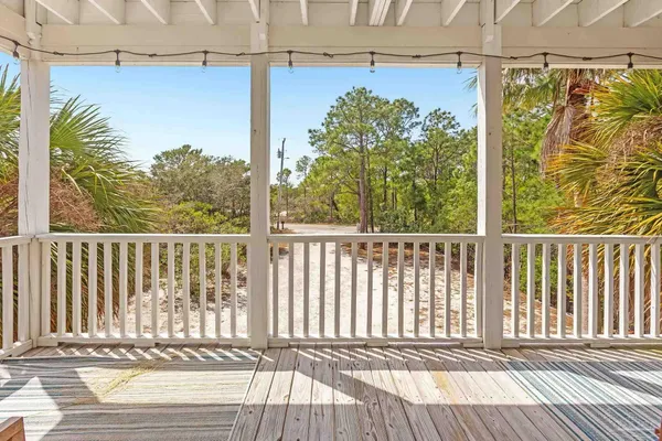 a view of a balcony with wooden floor