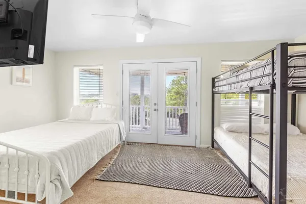 a bedroom with a bed and a mirror