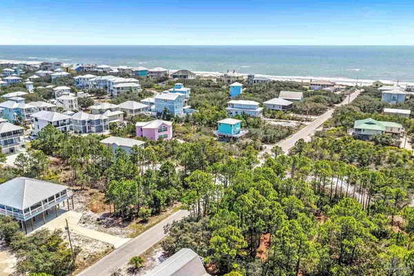 an aerial view of residential building with green space
