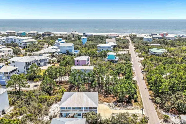 an aerial view of a city with ocean view
