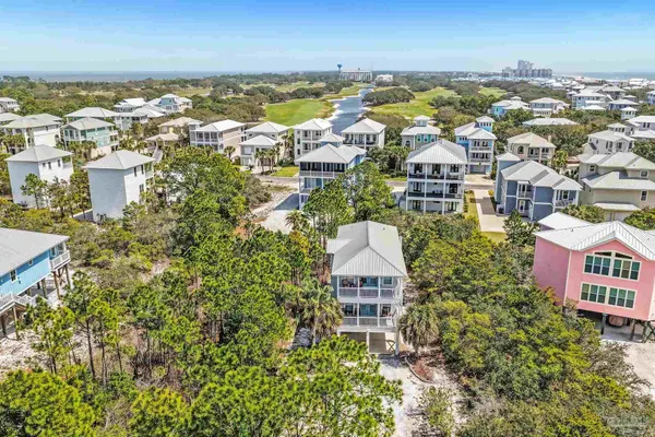 an aerial view of residential building and ocean