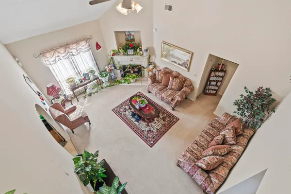 view of a living room with furniture and a chandelier