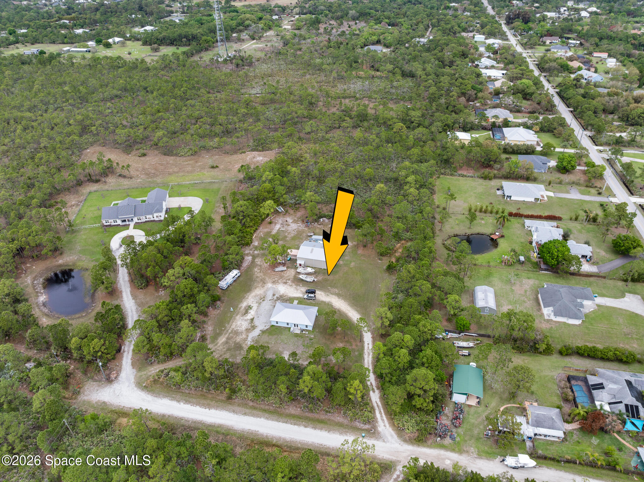 4310 Sand Point Road Grant Valkaria, FL 32949 - Photo 34 of 50 an aerial view of residential houses with outdoor space and street view