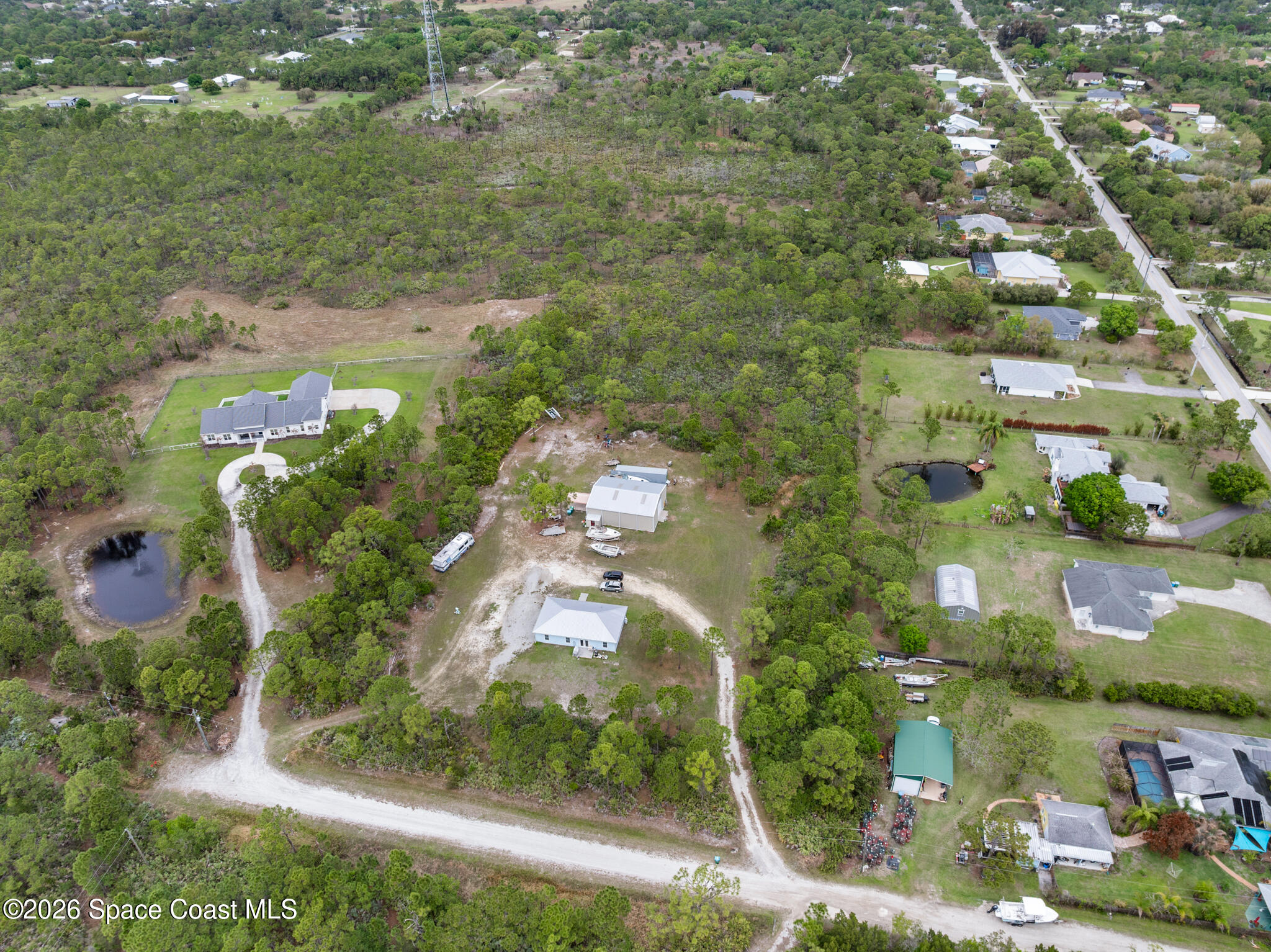 4310 Sand Point Road Grant Valkaria, FL 32949 - Photo 35 of 50 an aerial view of residential houses with outdoor space and street view