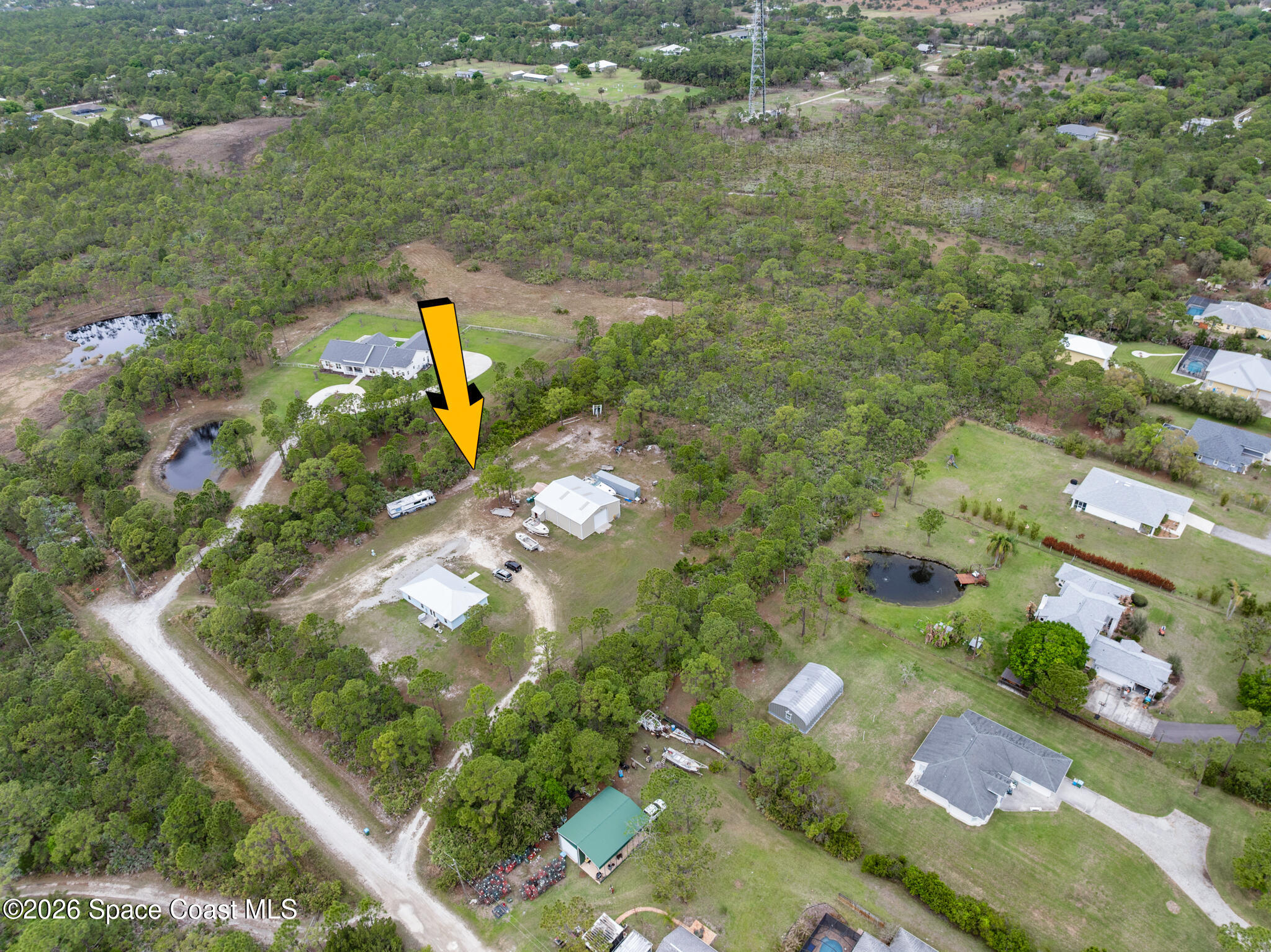 4310 Sand Point Road Grant Valkaria, FL 32949 - Photo 36 of 50 an aerial view of residential houses with outdoor space