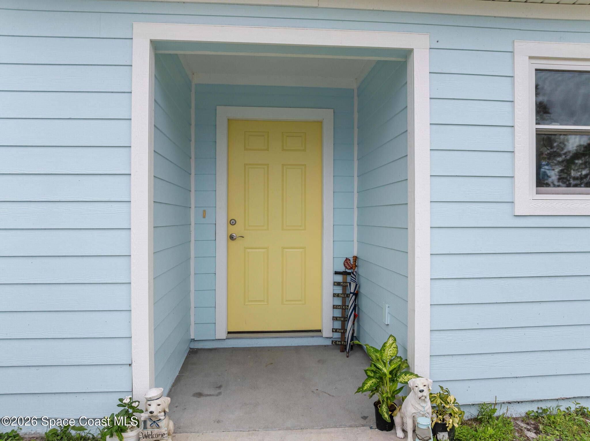 4310 Sand Point Road Grant Valkaria, FL 32949 - Photo 42 of 50 a view of front door of a house