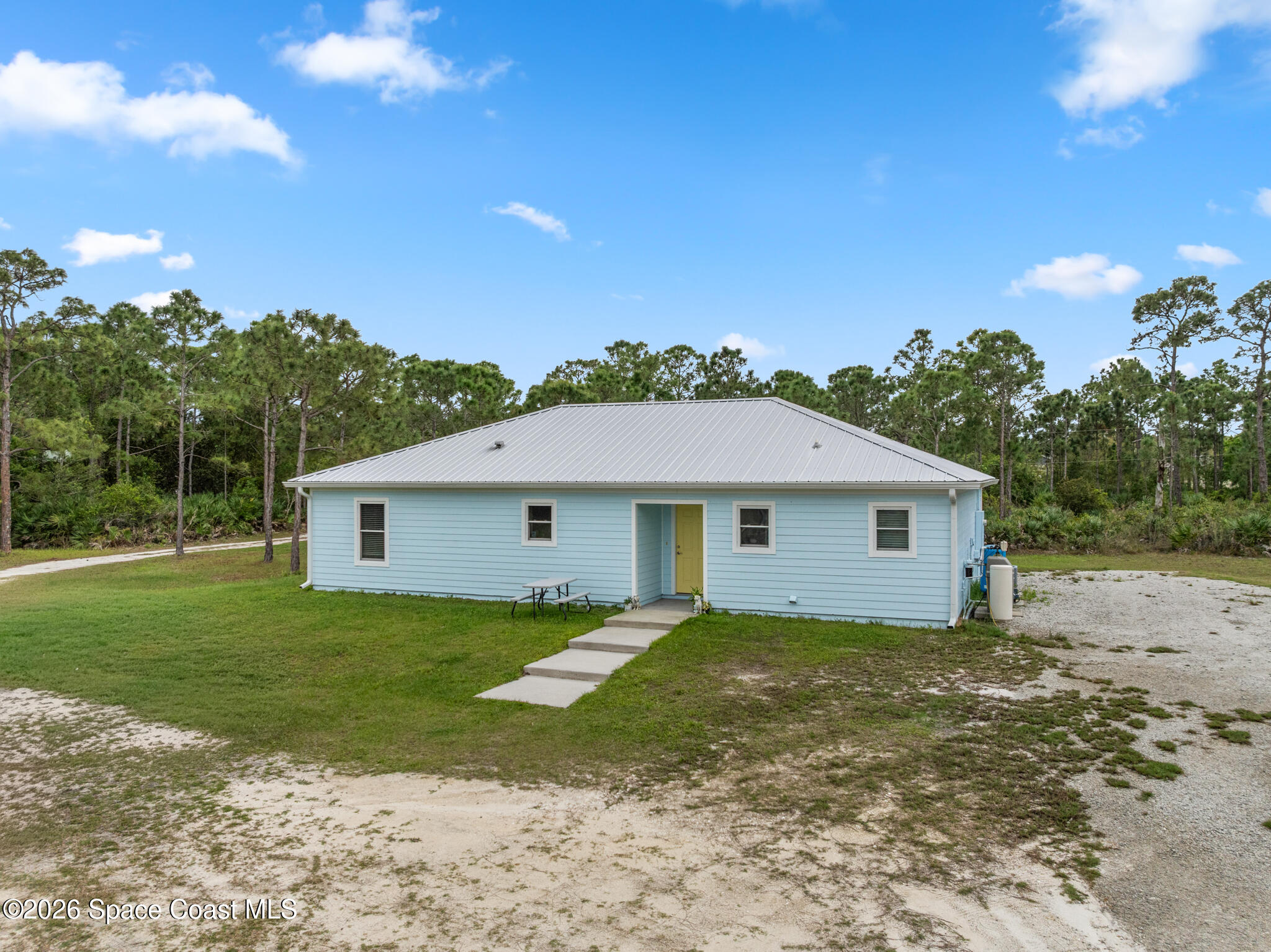 4310 Sand Point Road Grant Valkaria, FL 32949 - Photo 44 of 50 a view of a house with a backyard