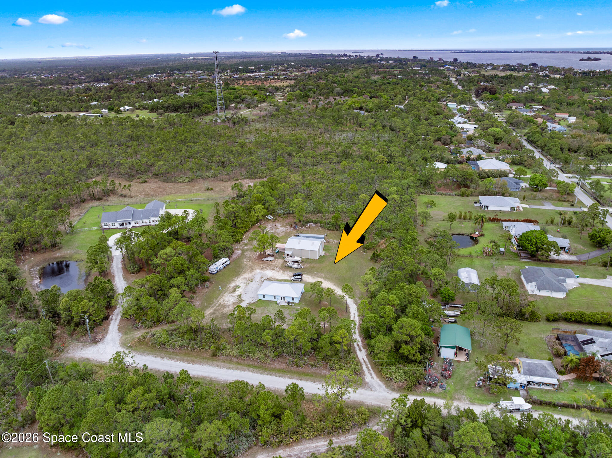4310 Sand Point Road Grant Valkaria, FL 32949 - Photo 45 of 50 an aerial view of beach and residential houses with outdoor space