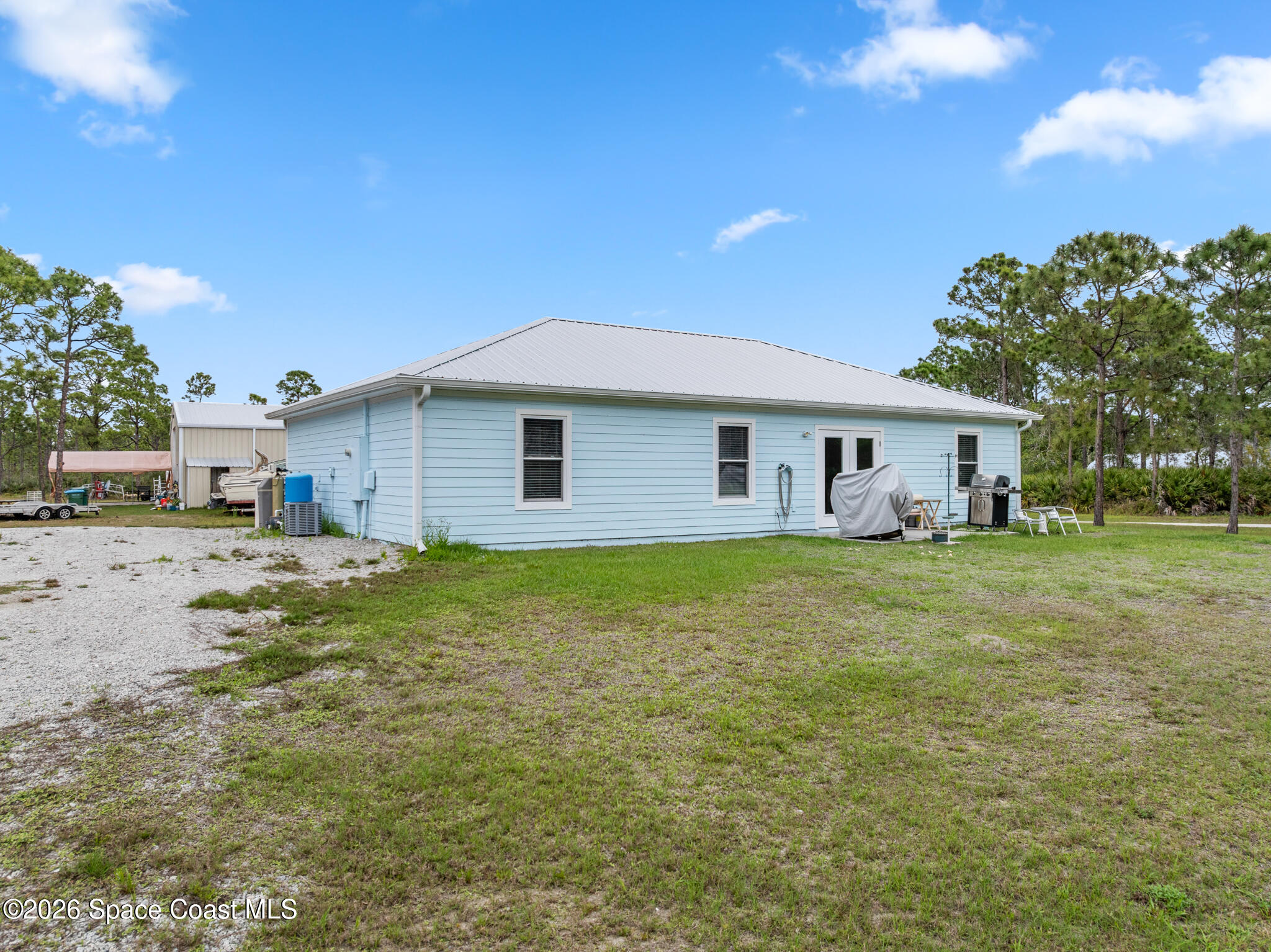 4310 Sand Point Road Grant Valkaria, FL 32949 - Photo 46 of 50 a outdoor view with a seating space