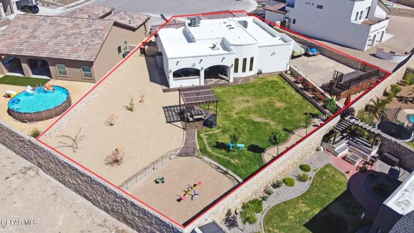 an aerial view of a house with a garden