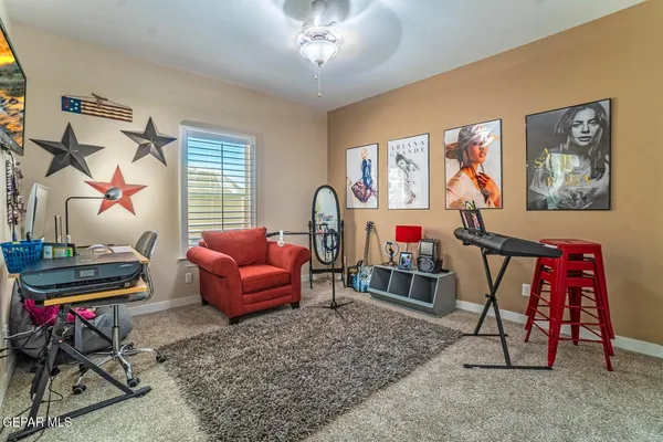 a living room with furniture a air conditioner vent and a window