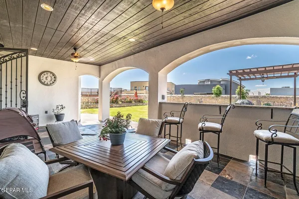 a view of a dining room with furniture window and outside view
