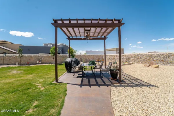 a patio with table and chairs