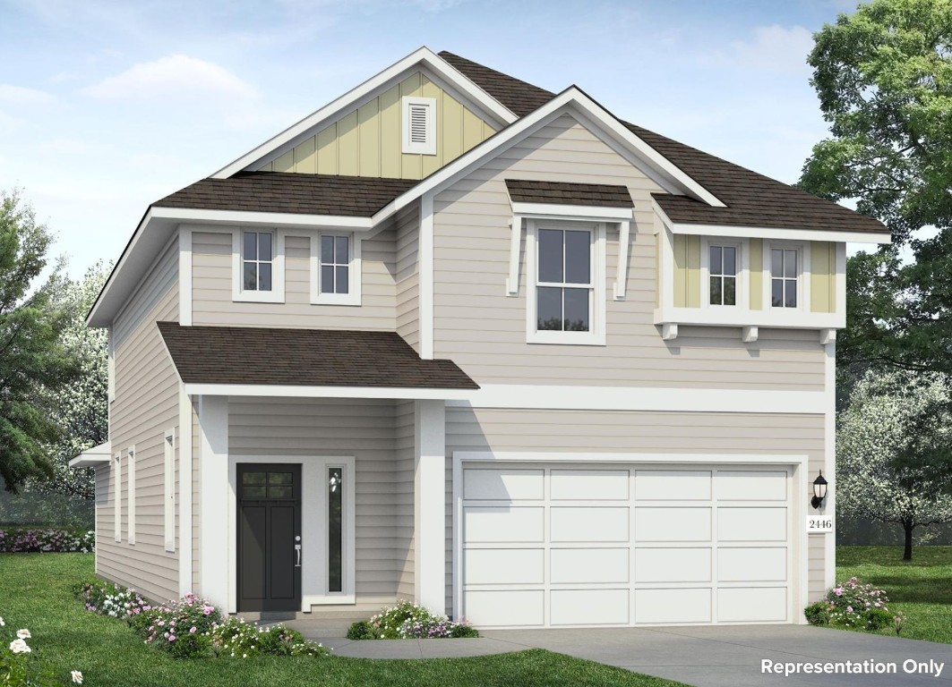 a front view of a house with a yard and garage